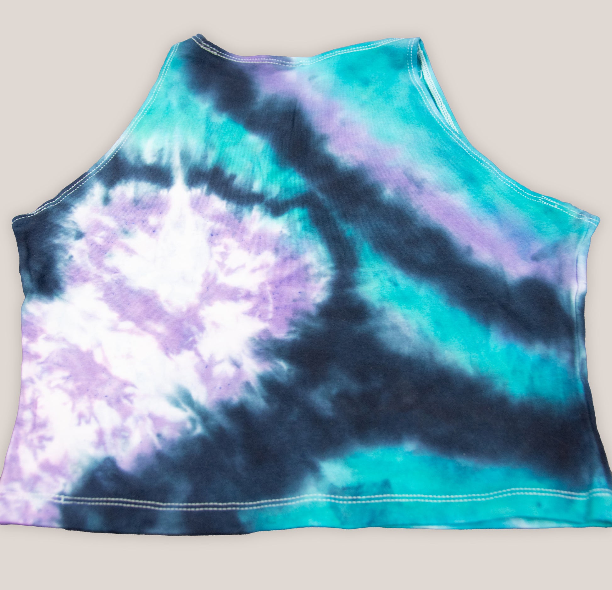 Black, teal, and purple tie dye crop top by Akasha Sun.