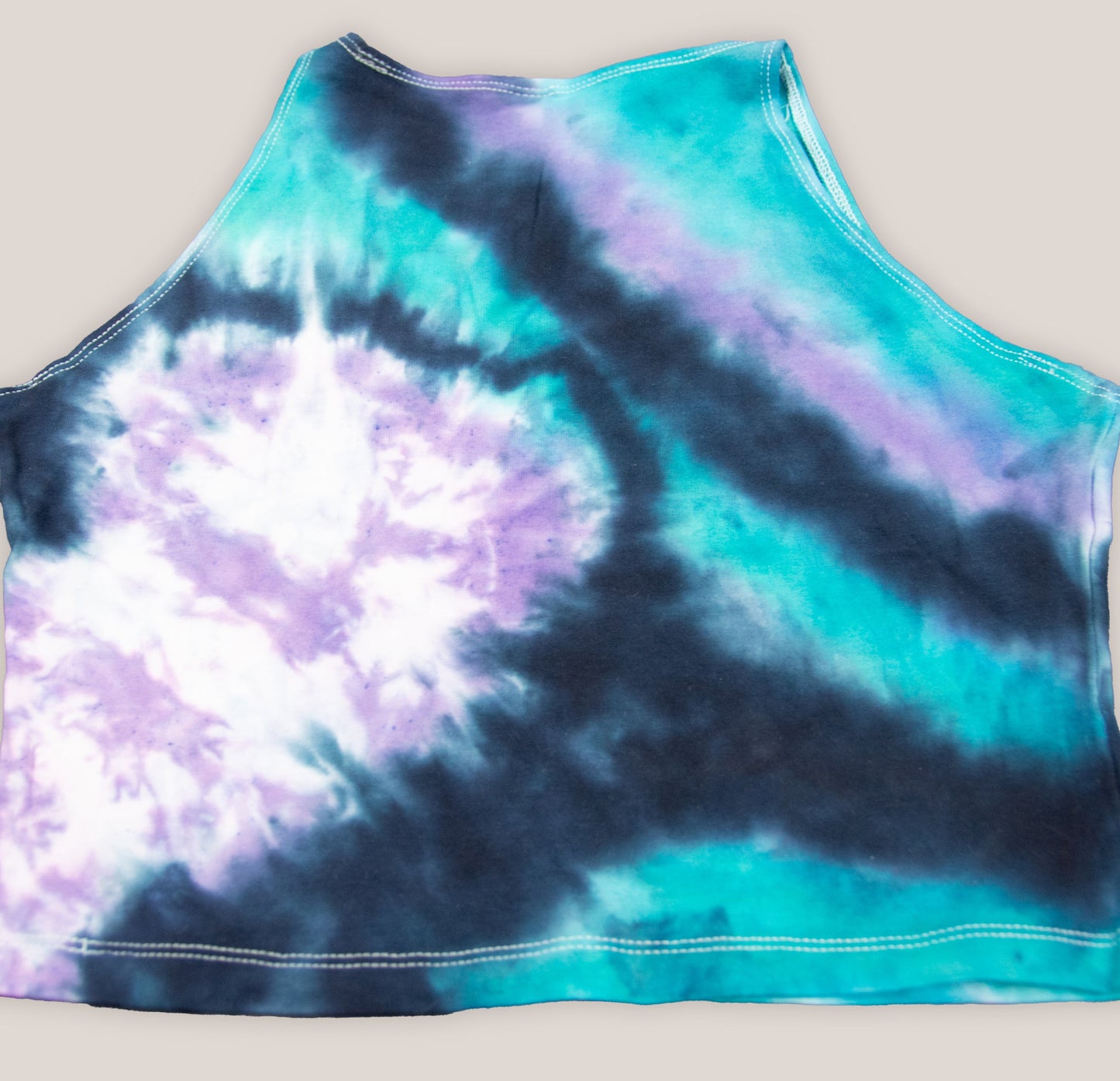 Black, teal, and purple tie dye crop top by Akasha Sun.