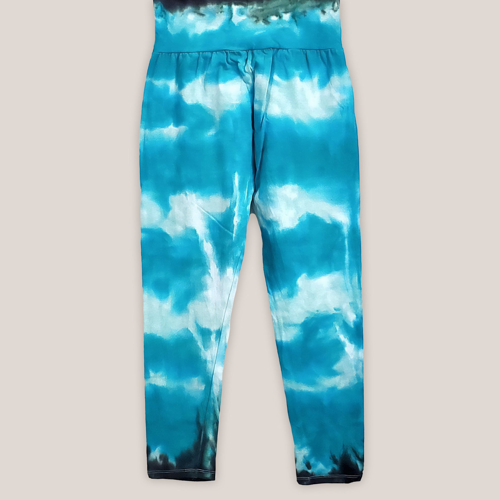 Teal tie dye yoga leggings with a wide waistband.