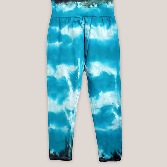 Teal tie dye yoga leggings with a wide waistband.