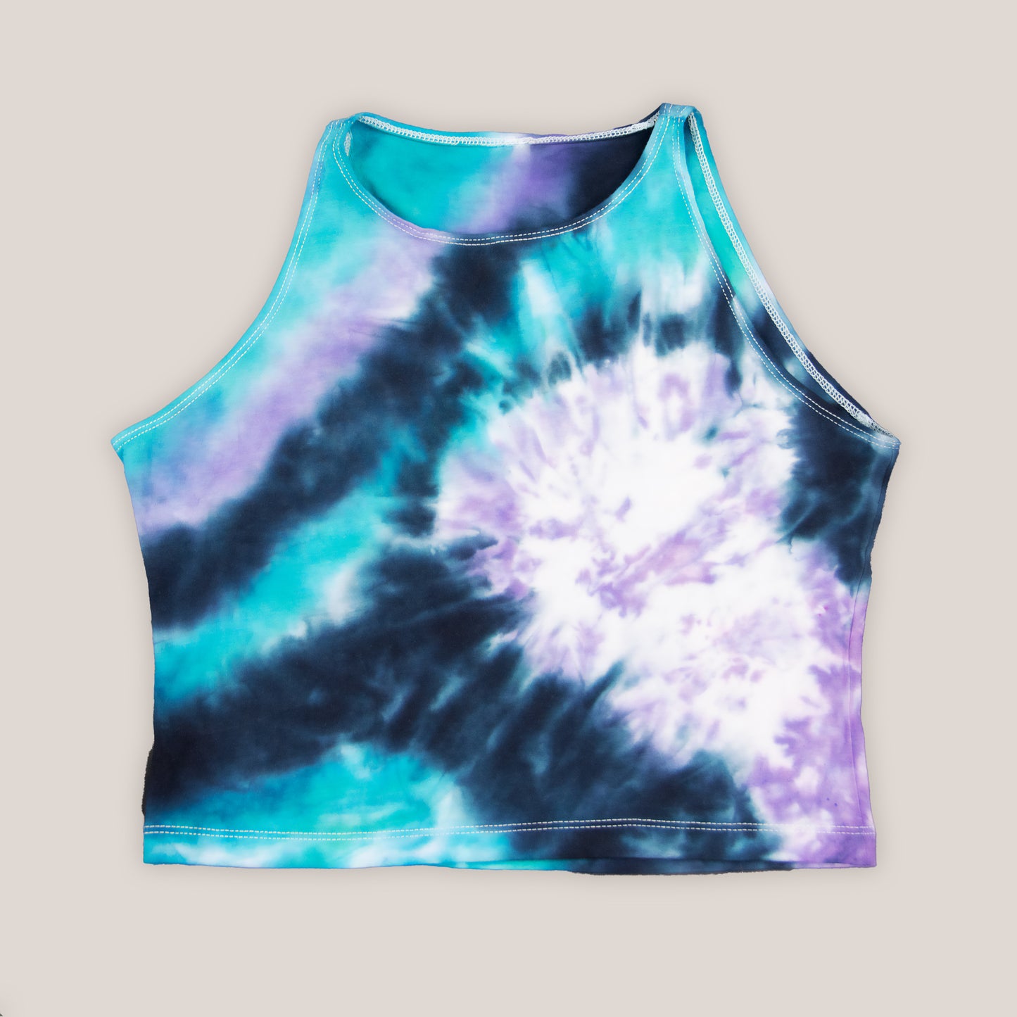 Black, teal, and purple tie dye crop top by Akasha Sun.