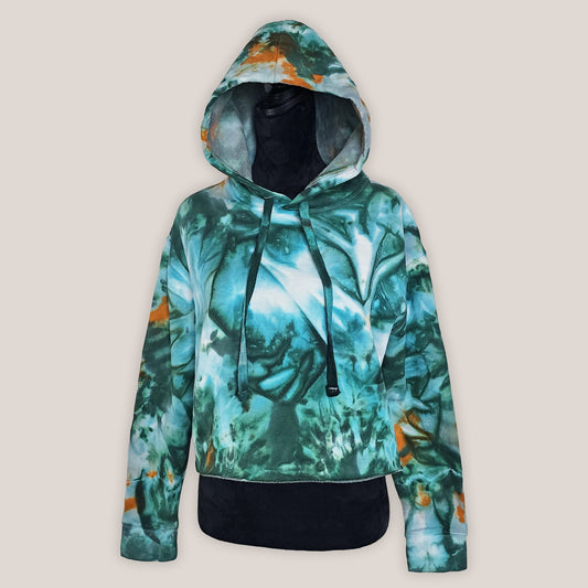Hoodie with a green and orange abstract pattern on a beige background