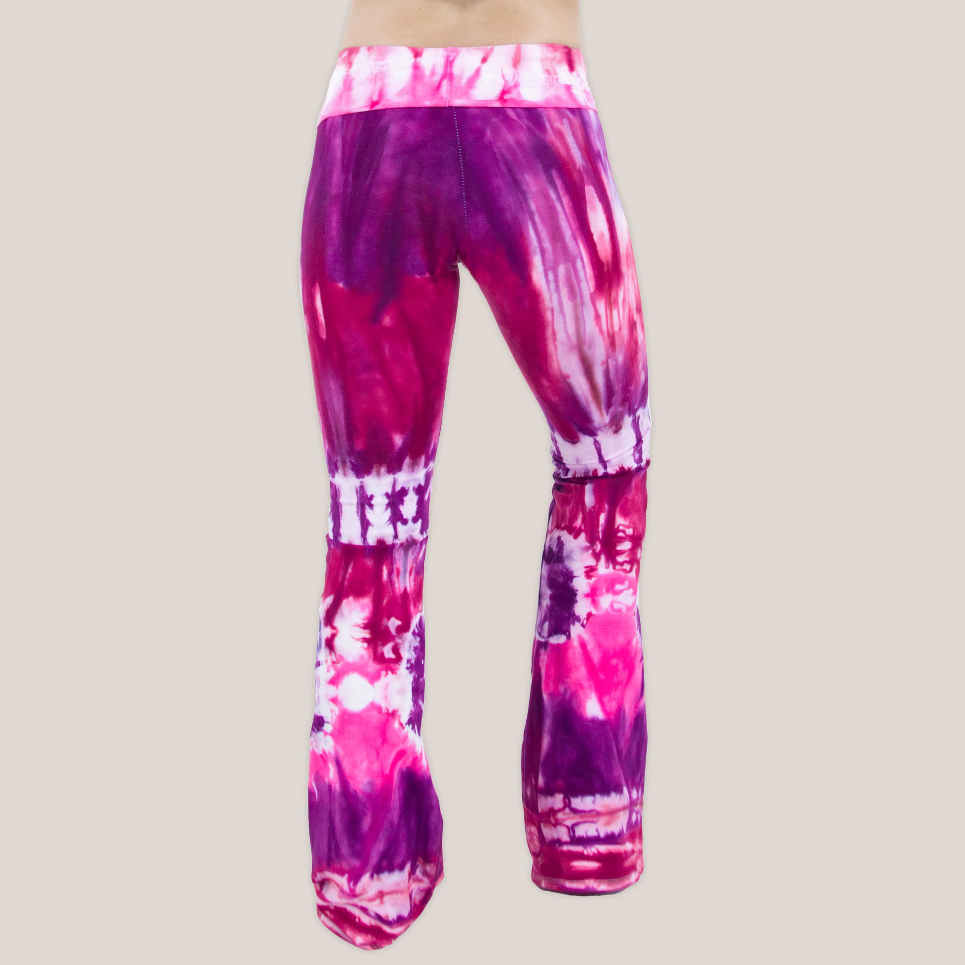 Pink, red, and purple tie dye yoga pants with a wide waistband by Akasha Sun.
