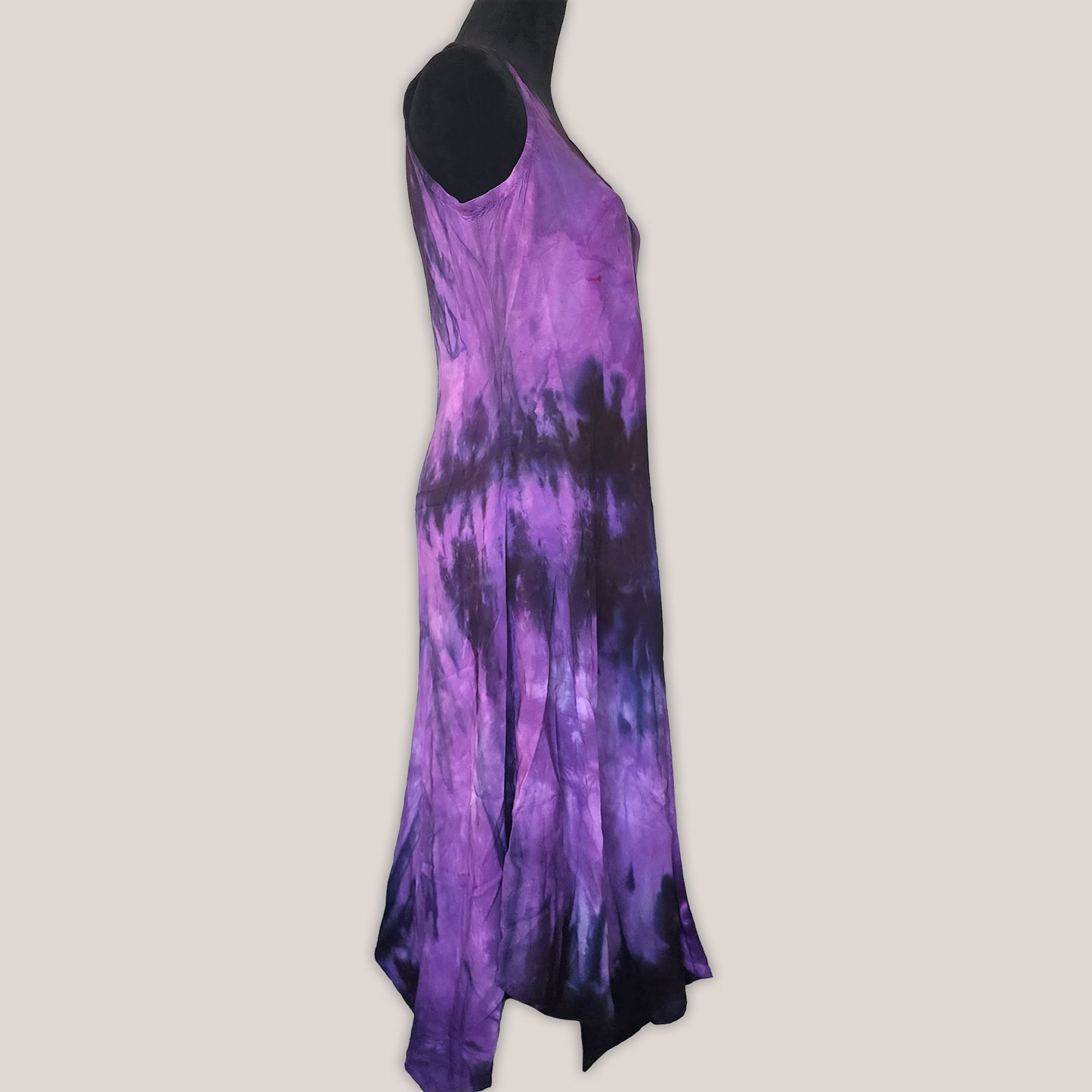 Purple tie-dye dress on a beige background