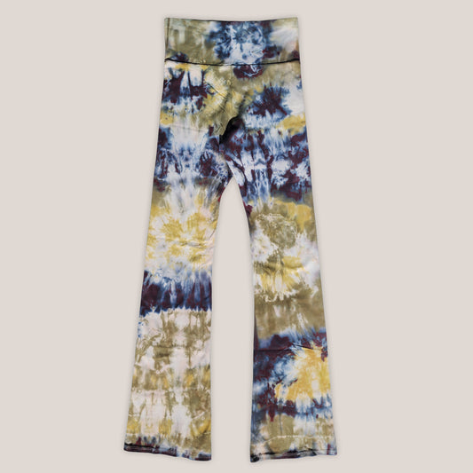 Tie-dye leggings with a multicolor pattern on a light gray background