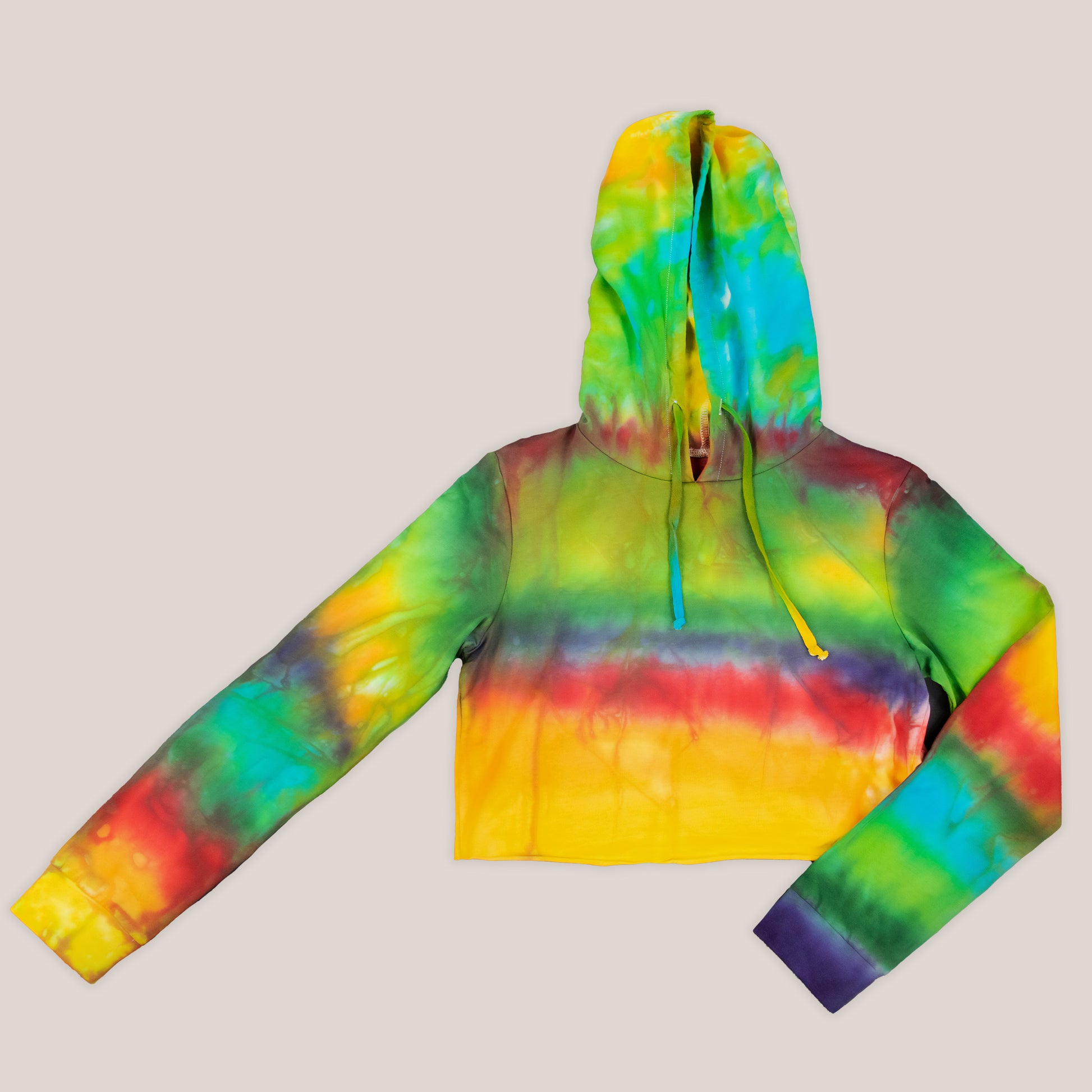 Rainbow tie dye hoodie crop top with a hood, drawstrings, and long sleeves.