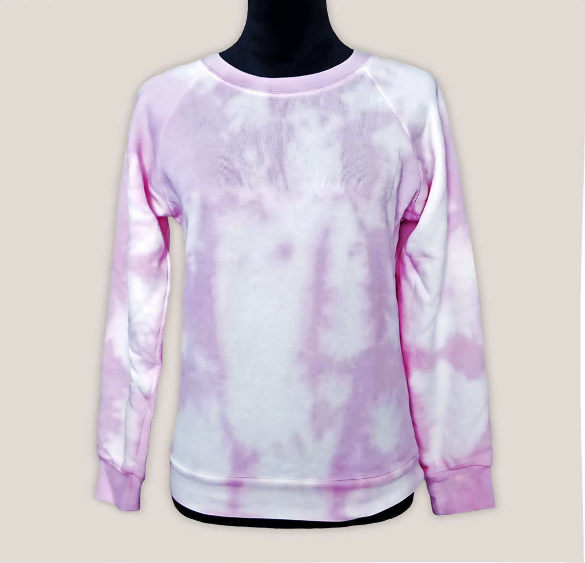 Tie-dye pink sweatshirt on a mannequin against a beige background