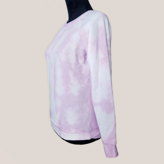 Pink tie-dye sweatshirt on a beige background