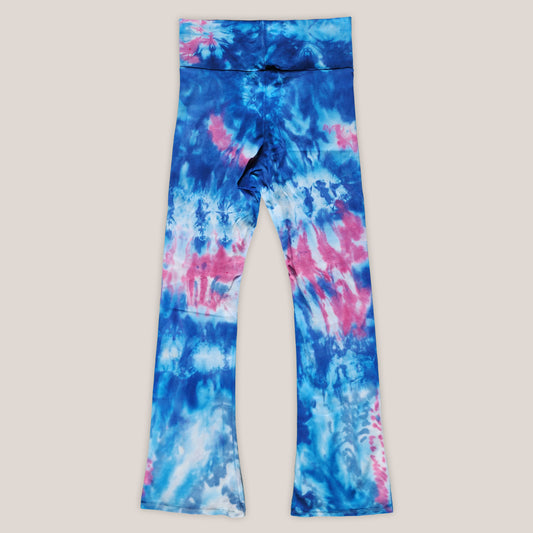 Tie-dye leggings with blue and pink patterns on a light gray background