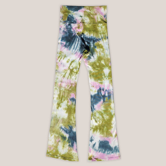 Colorful tie-dye pants on a beige background