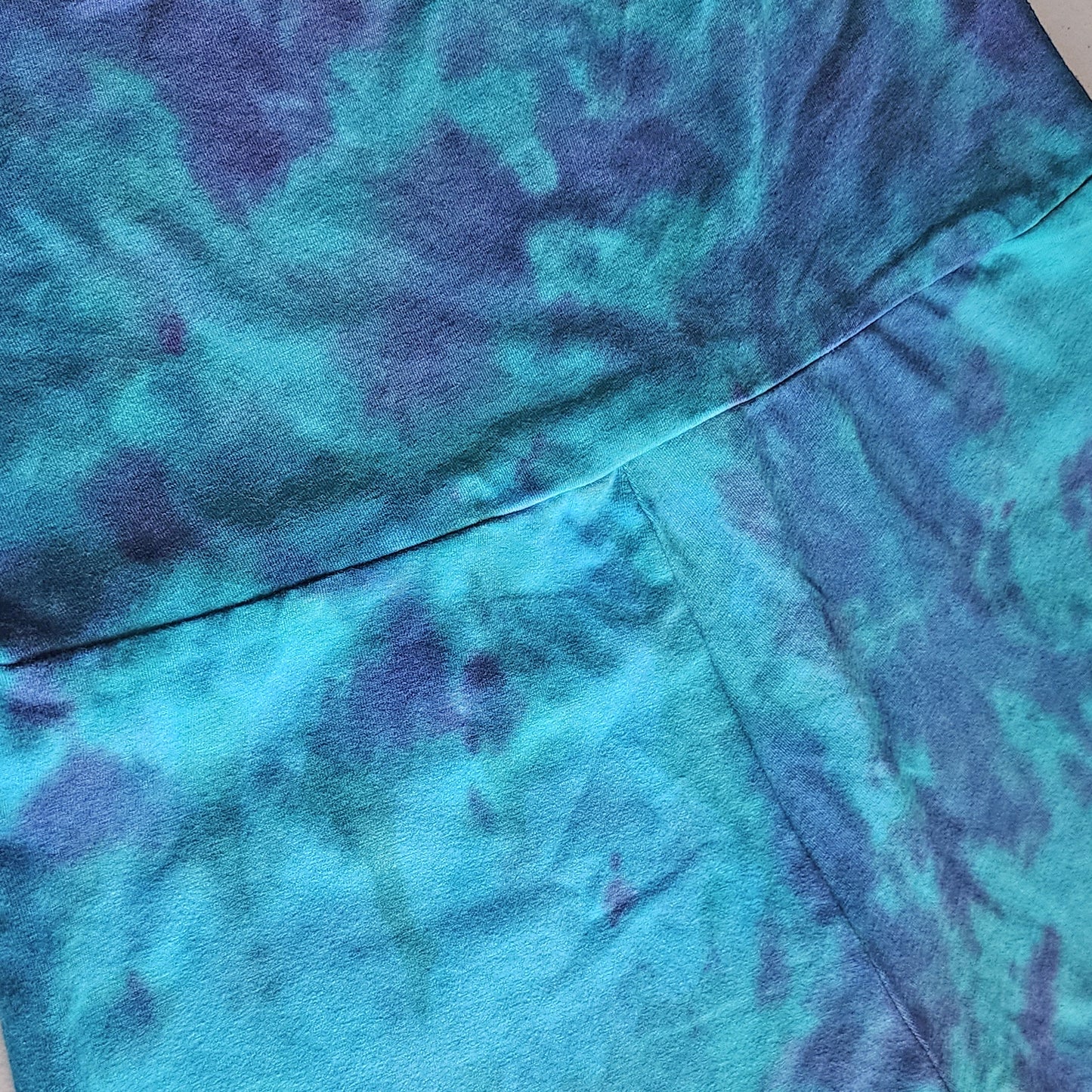 Close-up of blue and green tie-dye fabric