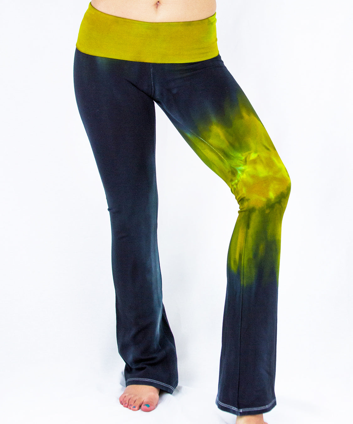 Black and green tie dye yoga pants featuring a fold over waistband by Akasha Sun.