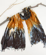 Orange and black tie dye scarf by Akasha Sun.