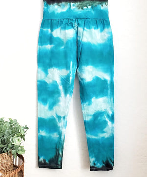 Teal tie dye yoga leggings with a wide waistband.