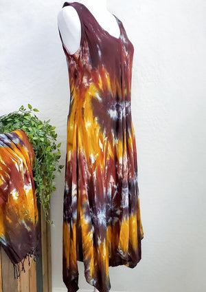 An amber and black tie dye short sleeve waterfall dress with a v-neck.
