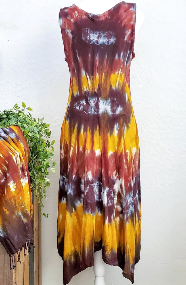 An amber and black tie dye short sleeve waterfall dress with a v-neck.