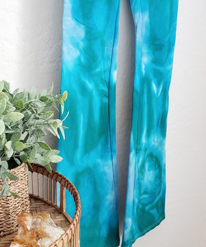 Teal tie dye yoga pants with wide waistband.