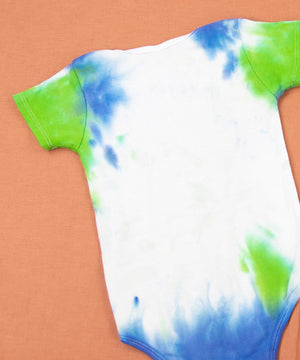 Blue, green, and white tie dye baby set that includes a bodysuit, hat, and bib.