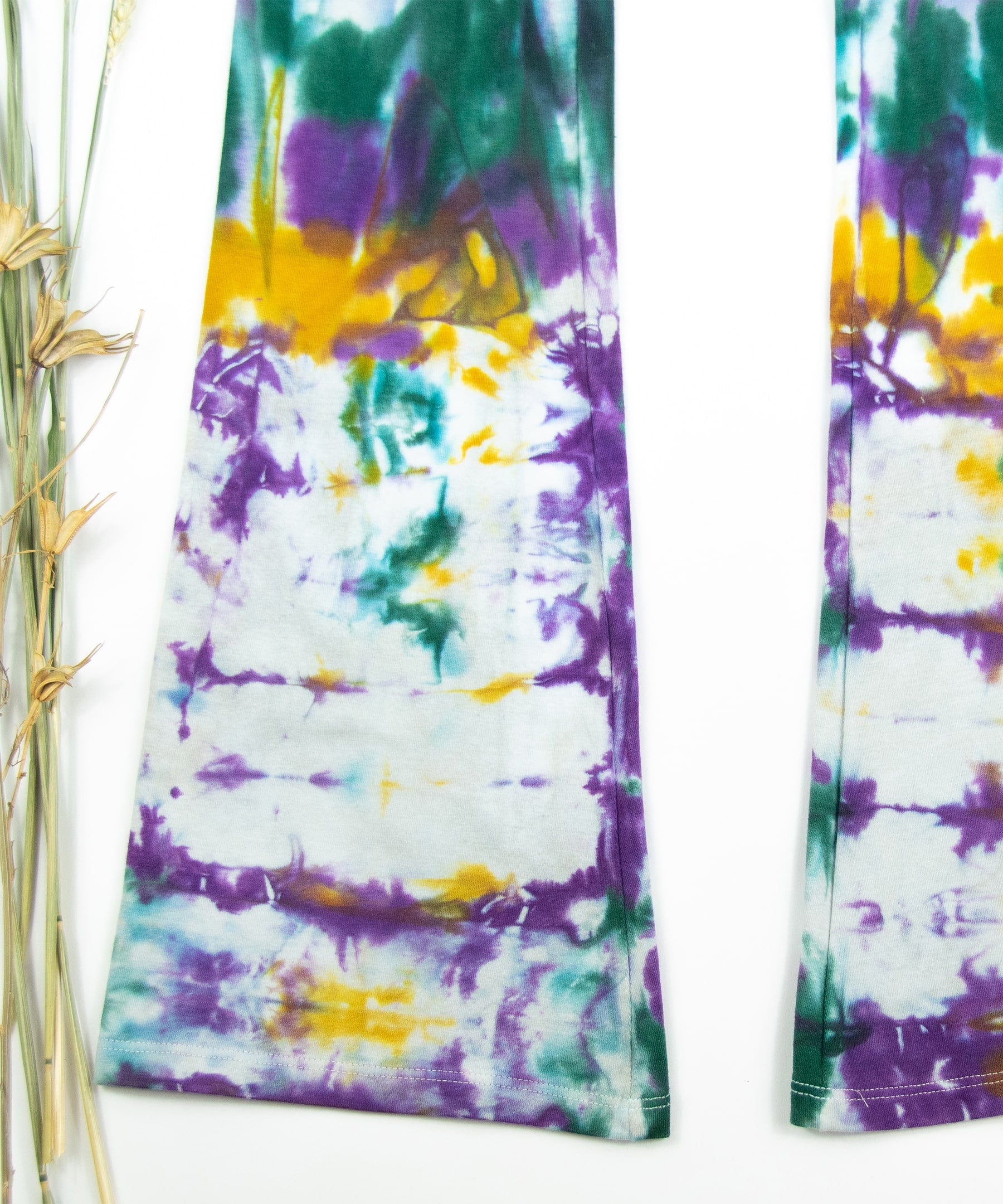 Tie dye Mardi Gras yoga pants with a foldover waistband by Akasha Sun.