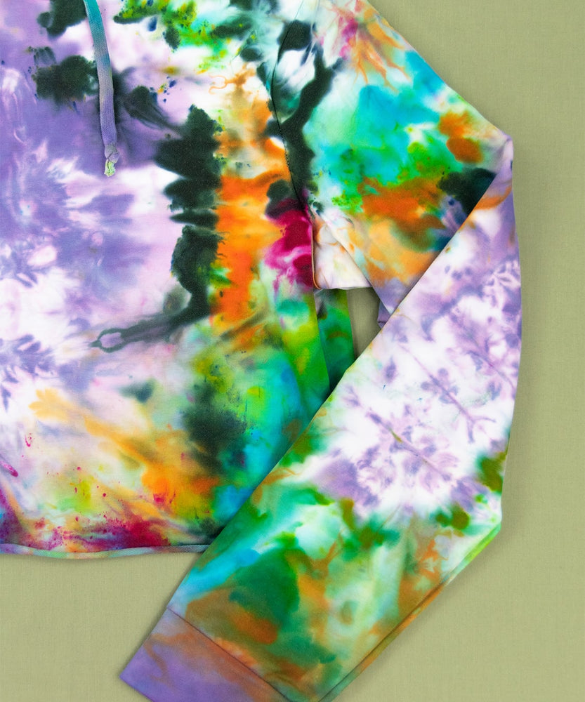 Rainbow tie dye hoodie crop top with a hood and drawstrings.