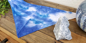 Our tie dye dog bandana in blue and white.