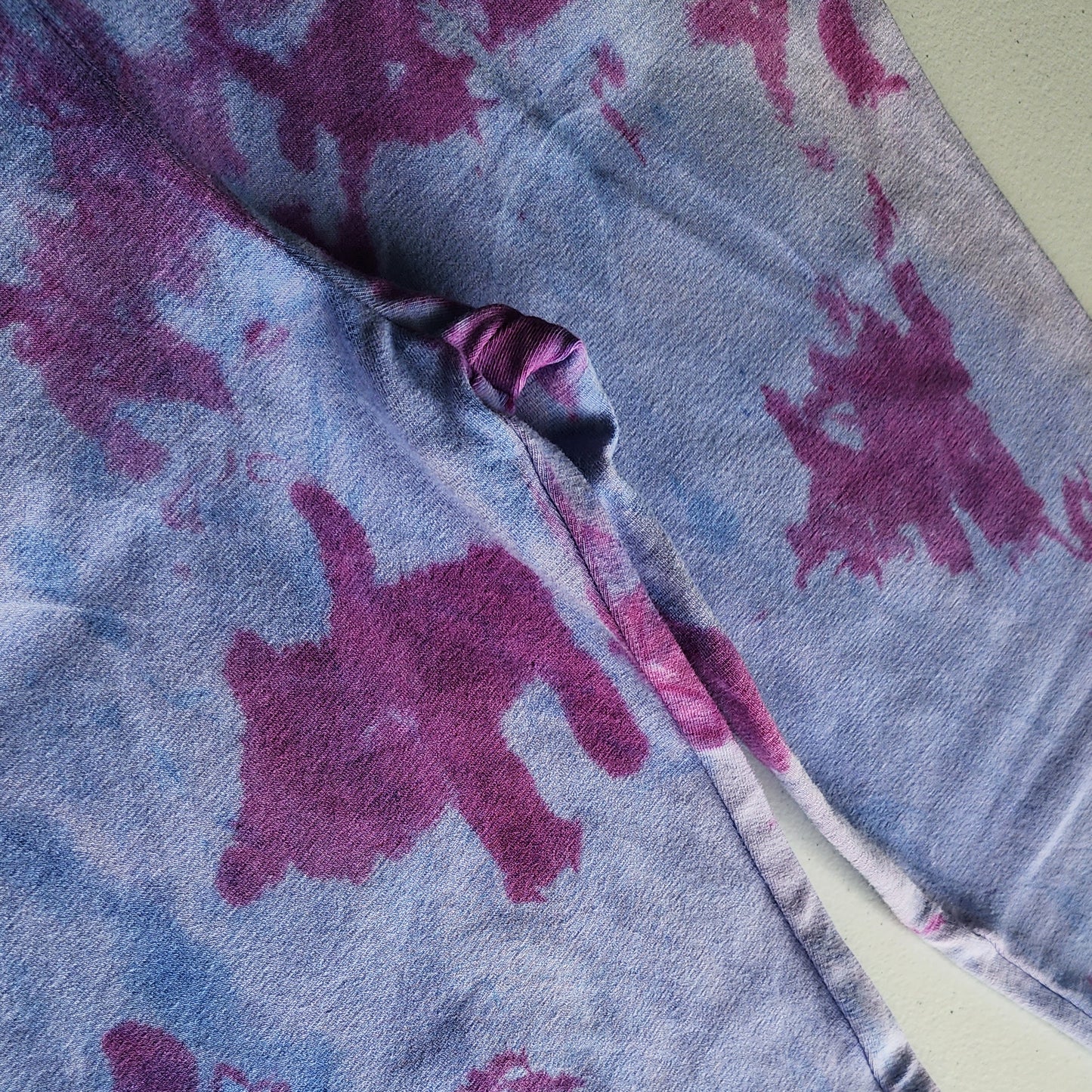 Close-up of a fabric with purple and blue abstract patterns