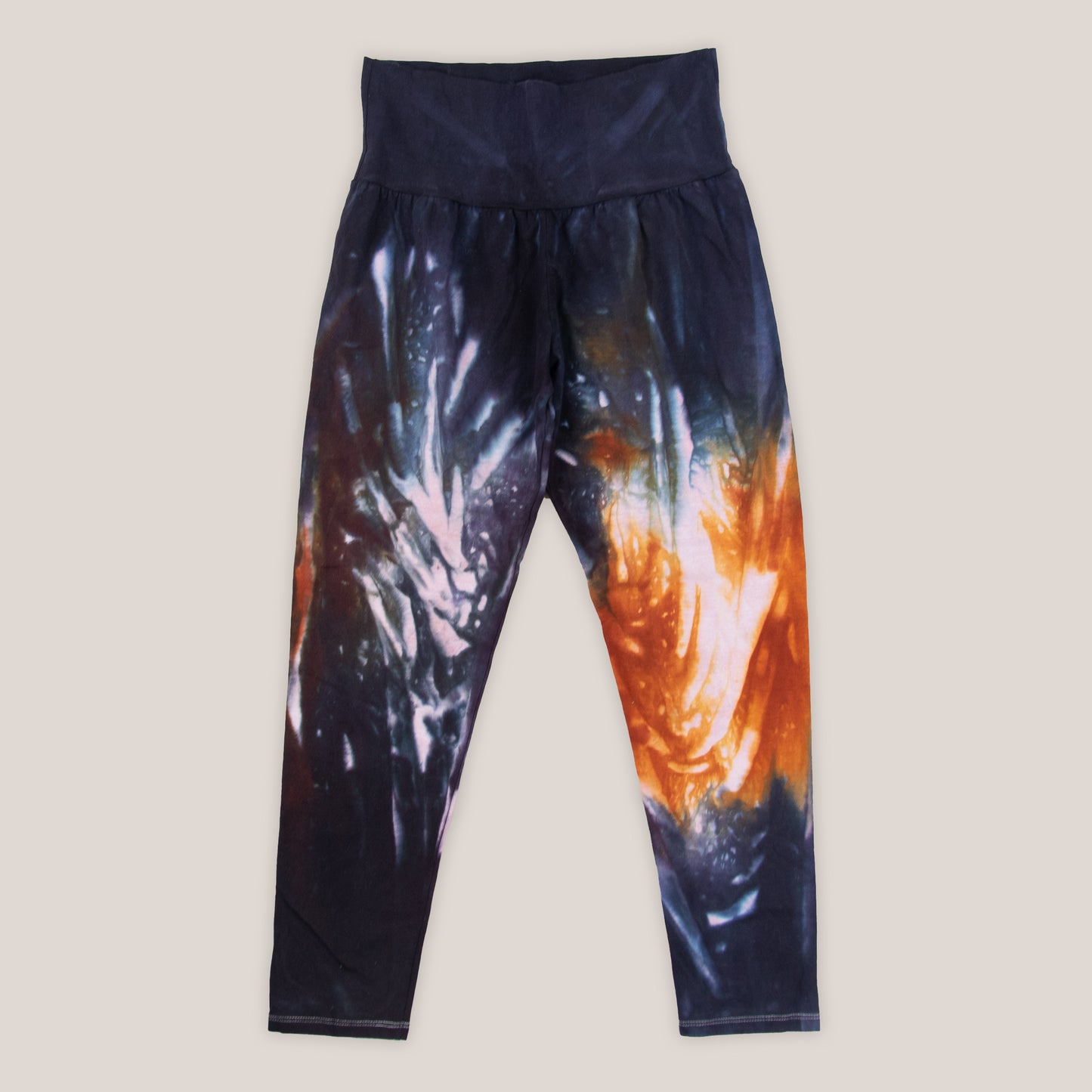 Orange and black tie dye fold over leggings by Akasha Sun.