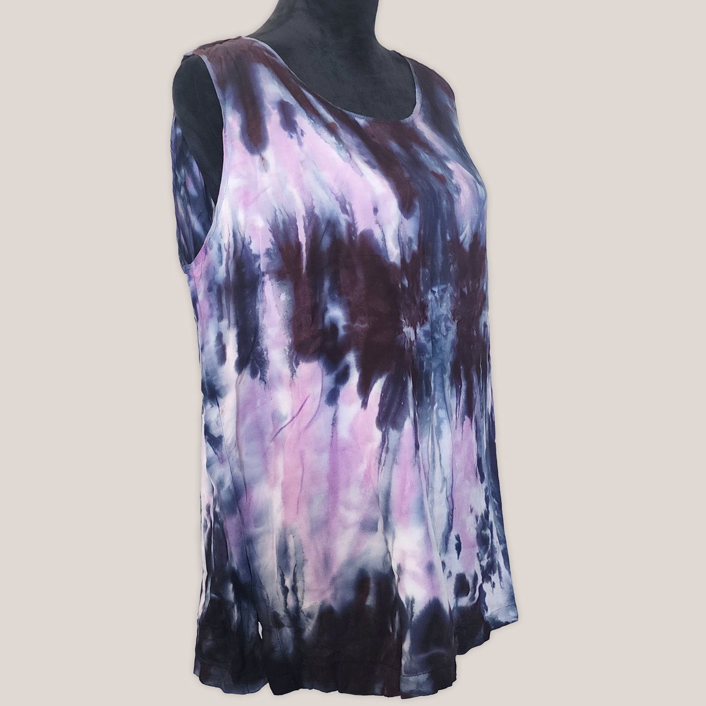 Sleeveless top with tie-dye pattern on a plain background