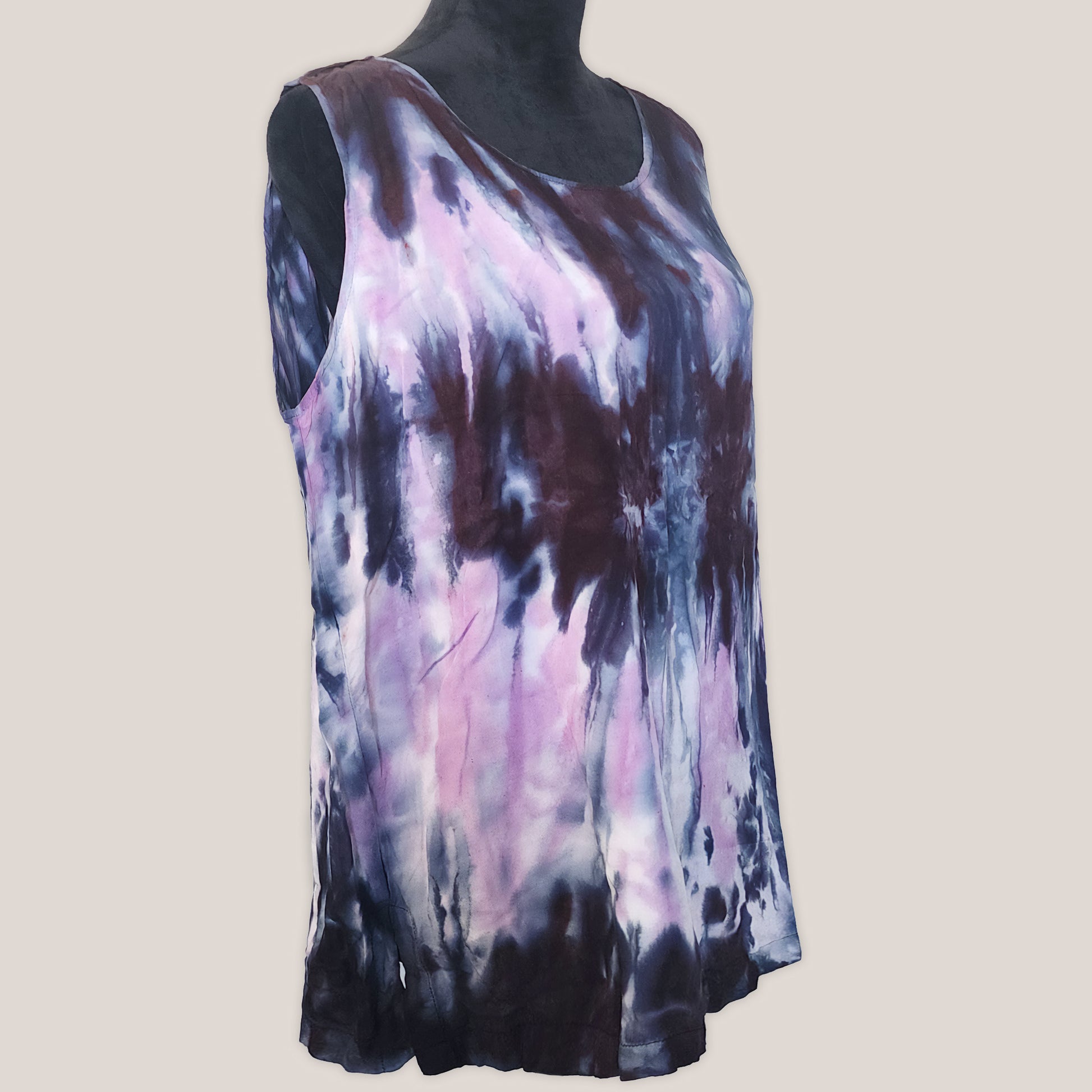 Sleeveless top with tie-dye pattern on a plain background