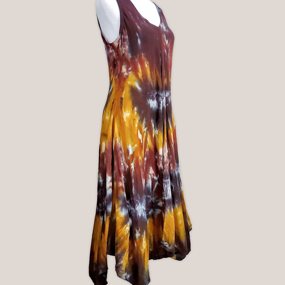 An amber and black tie dye short sleeve waterfall dress with a v-neck.