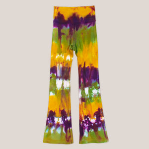 Green, purple, and yellow tie dye yoga pants with a wide waistband by Akasha Sun.