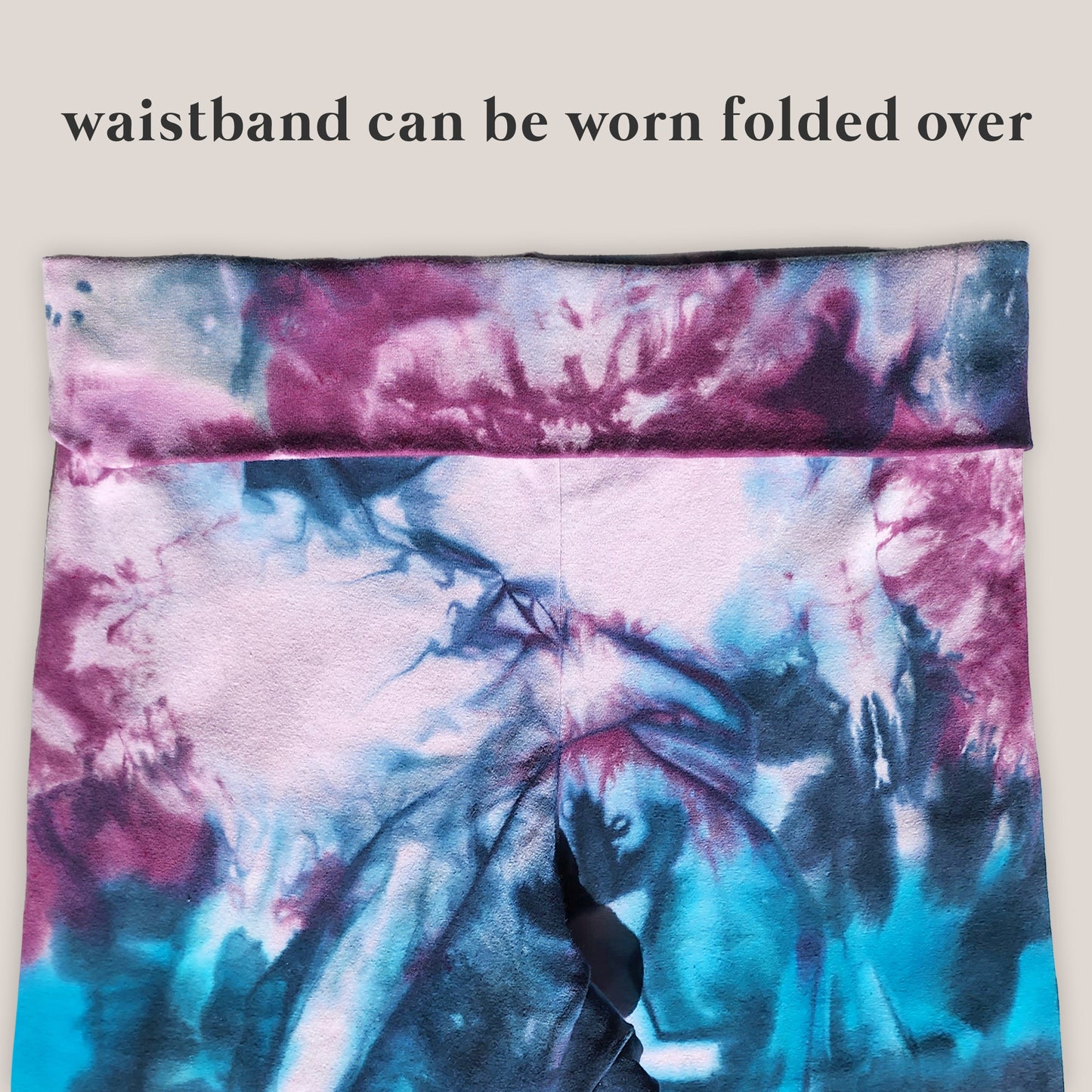 Tie-dye waistband with pink and blue patterns on a beige background
