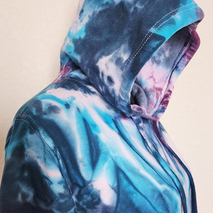 Tie-dye hoodie with a hood on a beige background