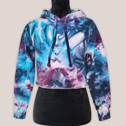 Multicolored tie-dye hoodie on a light gray background