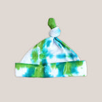 A green and teal tie dye organic baby hat.