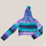 Purple, teal, and black tie dye hoodie crop top with a hood, drawstring, and long sleeves by Akasha Sun