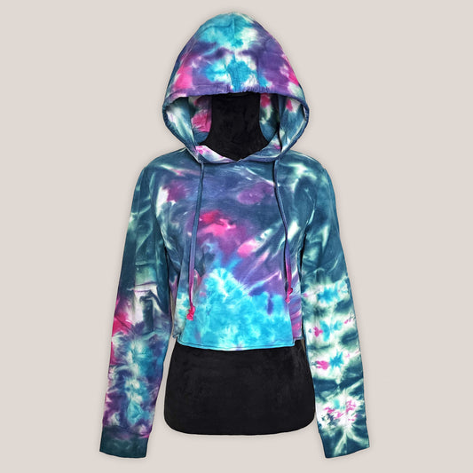 Colorful tie-dye hoodie on a black mannequin on a beige background