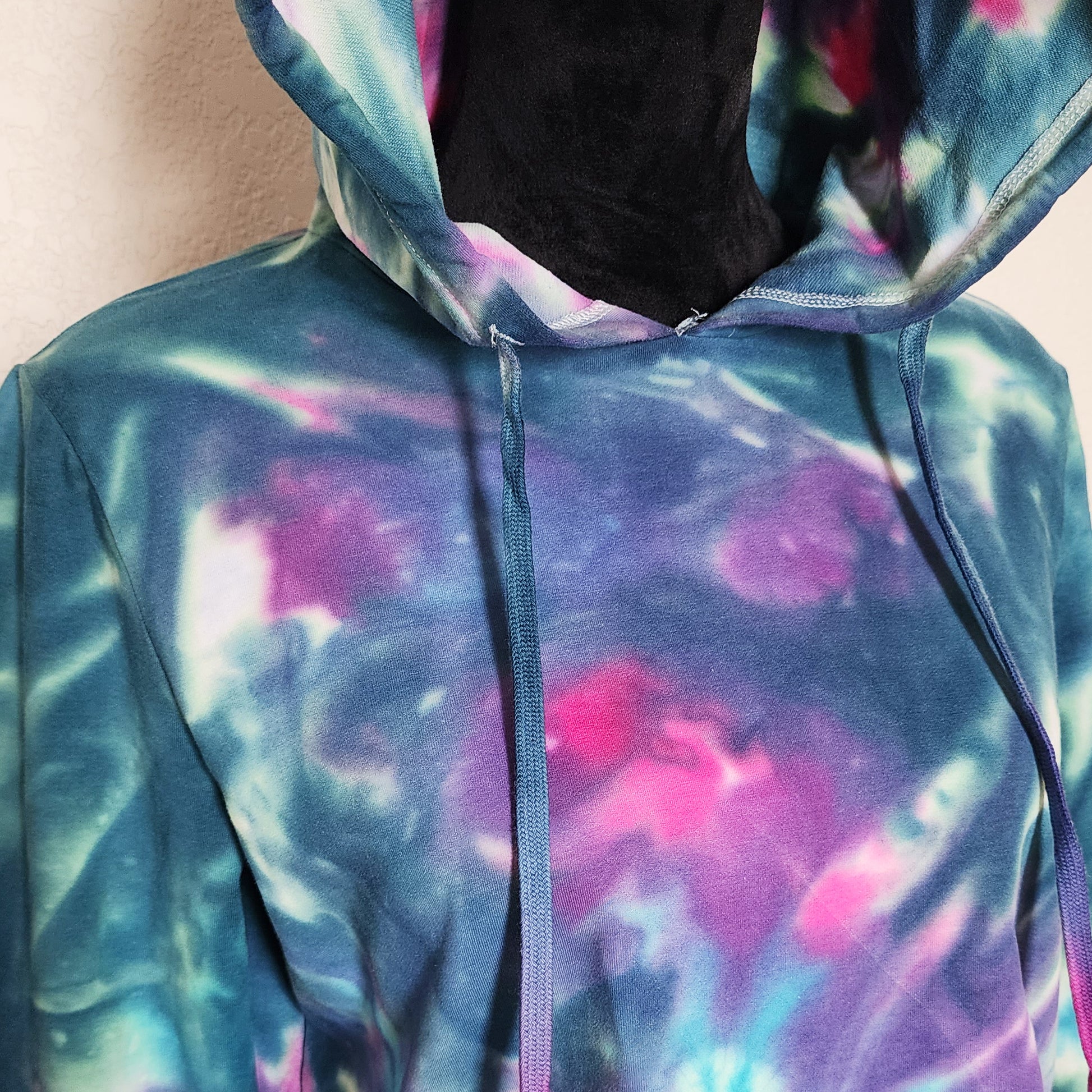 Multicolored hoodie with a tie-dye pattern
