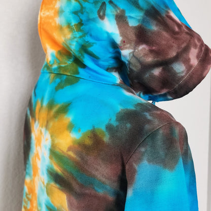 Tie-dye hoodie with multicolor pattern on a plain background