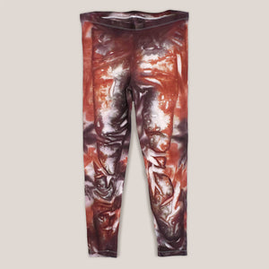 A burnt orange and brown tie dye pair of yoga leggings by Akasha Sun