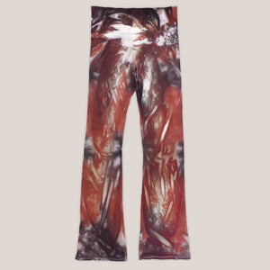 A rust and brown tie dye pair of yoga pants featuring a wide waistband by Akasha Sun