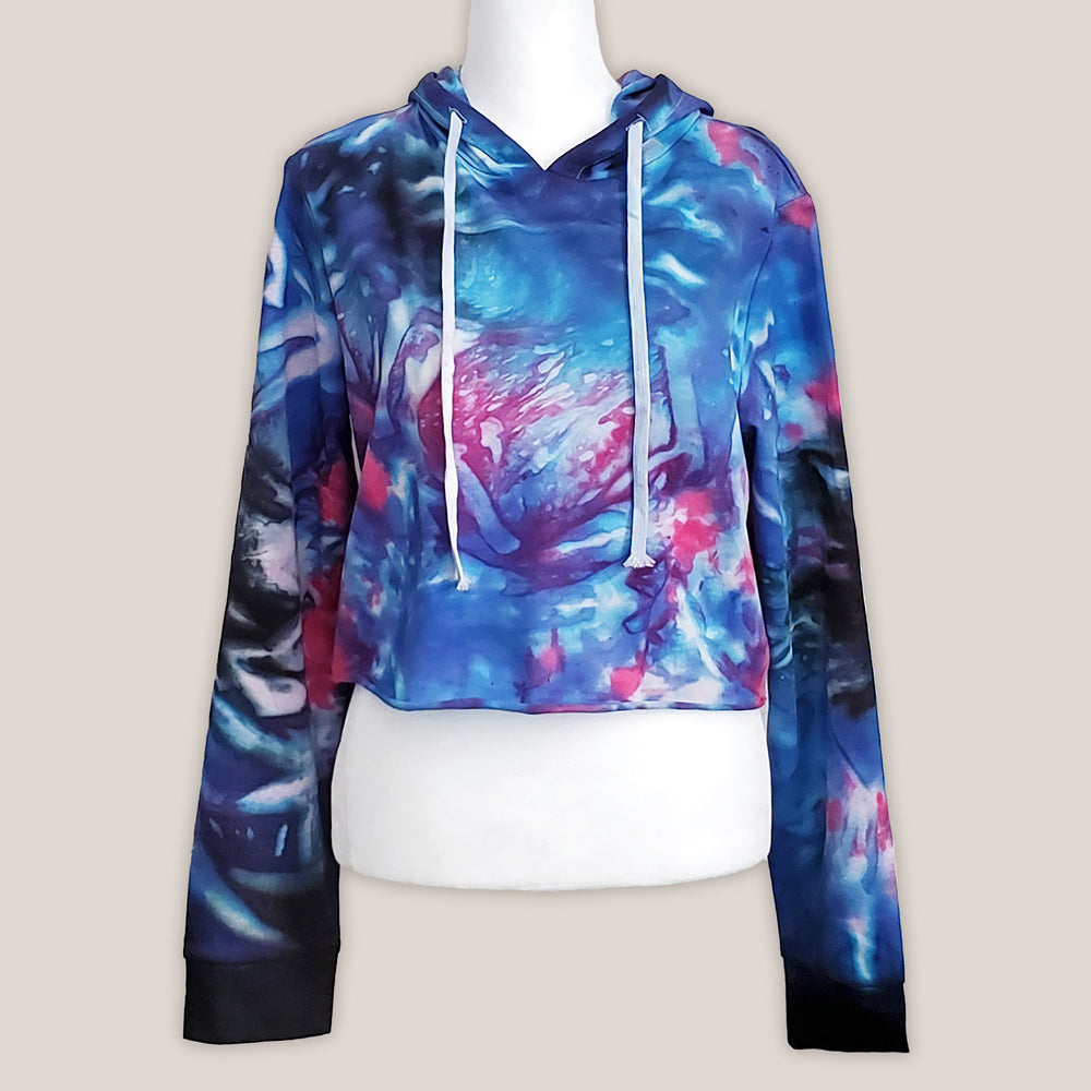 Blue, pink and black tie dye hoodie crop top with long sleeves and draw strings.