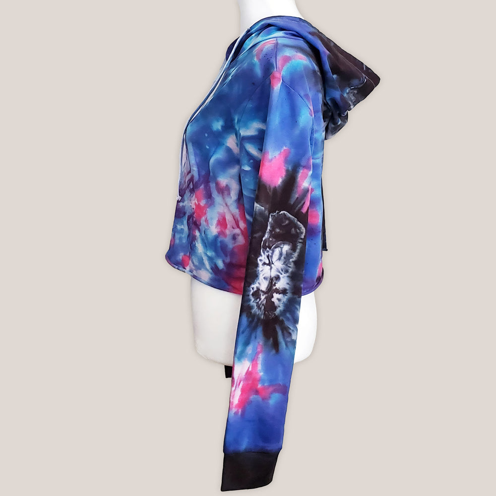 Blue, pink and black tie dye hoodie crop top with long sleeves and draw strings.