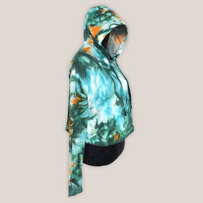 Hoodie with a tie-dye design in green and orange on a beige background