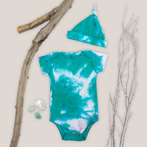 Teal and white organic tie dye bodysuit and baby hat set by Akasha Sun.