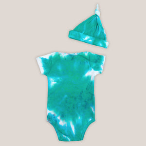 Teal and white organic tie dye bodysuit and baby hat set by Akasha Sun.