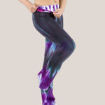 Woman wearing a pair of Akasha Sun sustainable cotton tie dye yoga pants in the colors black and purple.