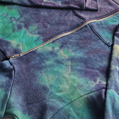Close-up of a tie-dye hoodie with a zipper detail