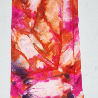 Up close colorful tie-dye pattern on pants on a white background