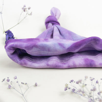 Purple organic cotton tie dye baby bodysuit and hat by Akasha Sun.